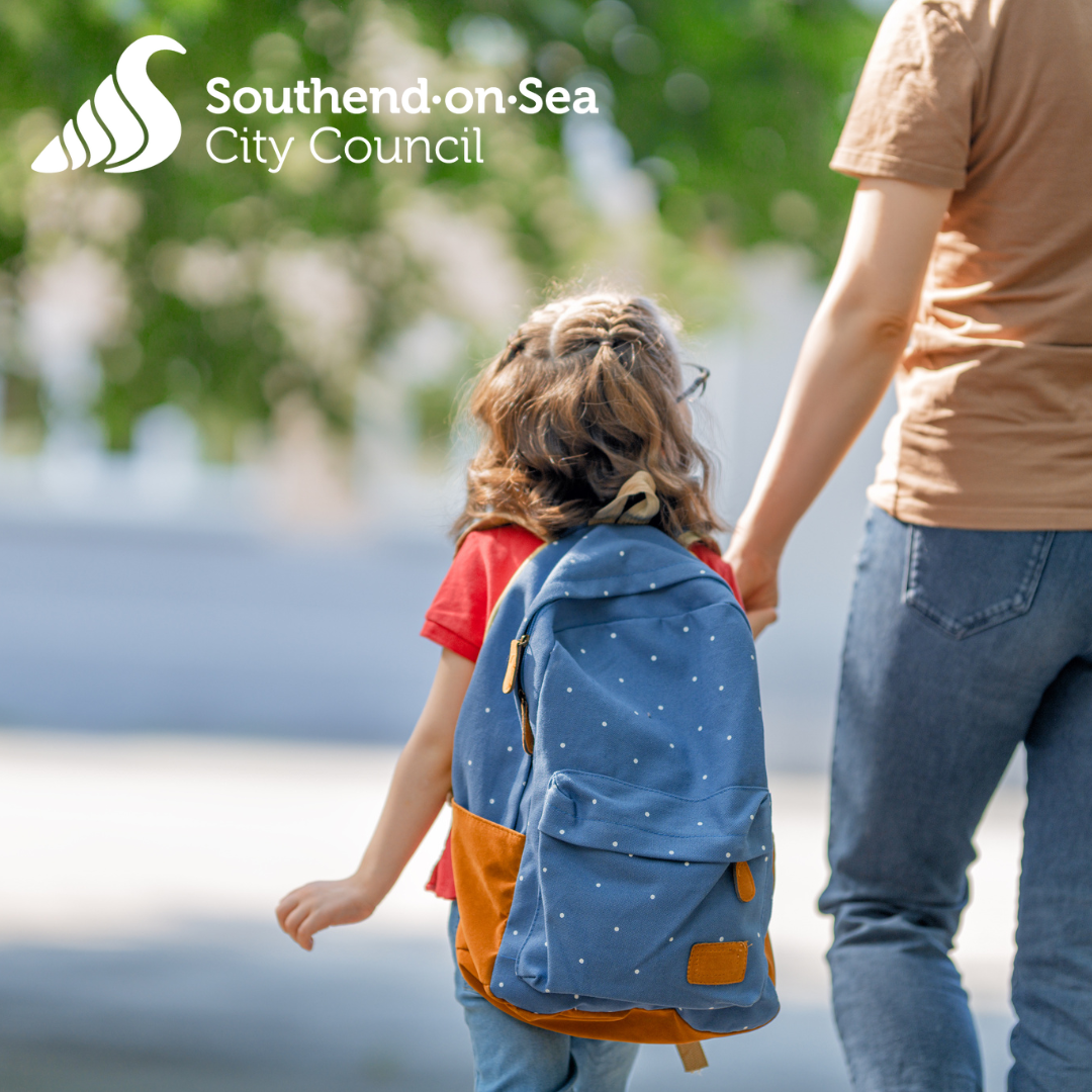 Child walking to school with adult